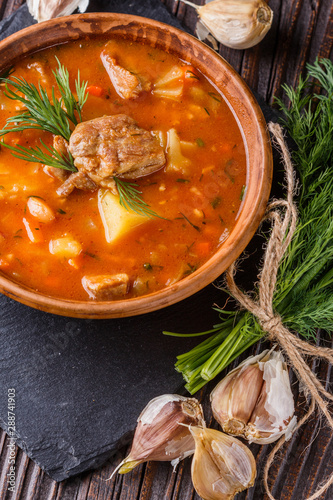 Chanahi a traditional Georgian meat stew in a bowl on stoyn board photo