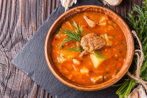 Chanahi a traditional Georgian meat stew in a bowl on stoyn board photo