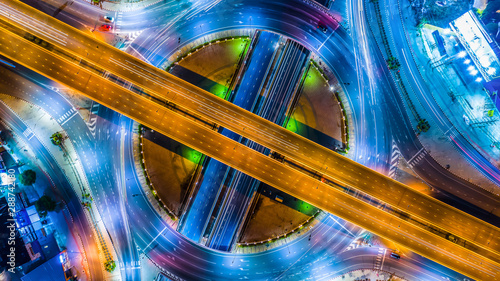 фотографія Aerial view Expressway motorway highway circus intersection at Night time Top view , Road traffic in city at thailand