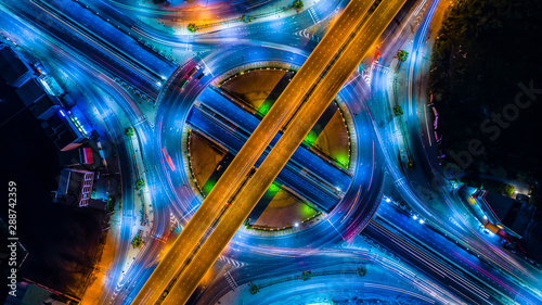 Aerial view Expressway motorway highway circus intersection at Night time Top view , Road traffic in city at thailand.