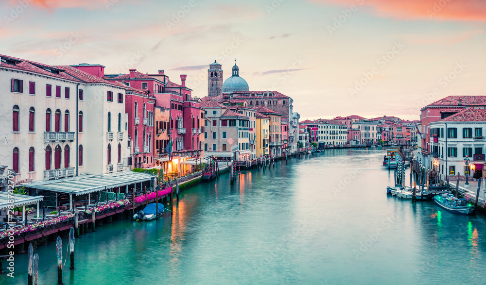 Captivating spring sunrise in Venice with San Geremia church on background. Colorful evening scene of Venice, Italy, Europe. Magnificent Mediterranean landscape. Traveling concept background.