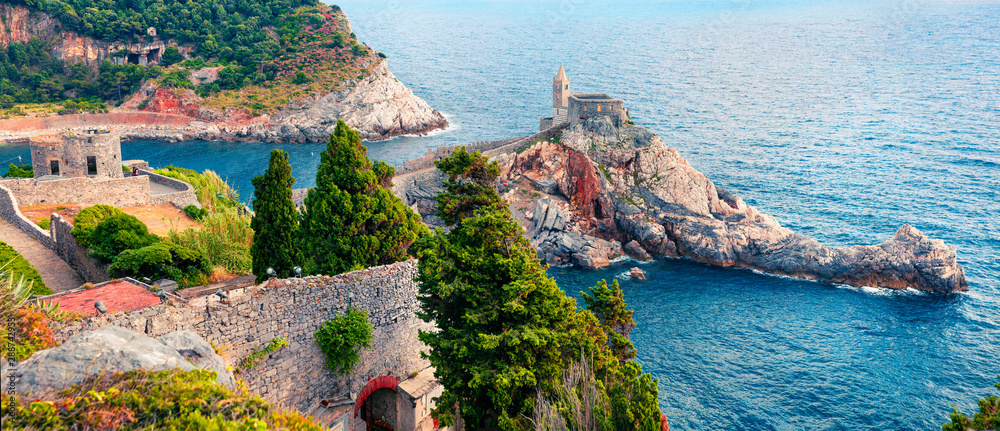 Beautiful morning view of Saint Peter Church in Portovenere town. Wonderful spring panorama of Mediterranean sea, Liguria, province of La Spezia, Italy, Europe. Traveling concept background.