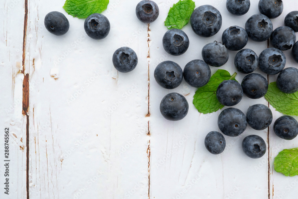 organic blueberries and leaves in wooden background, flavor concept organic blueberries and leaves in wooden background, flavor concept