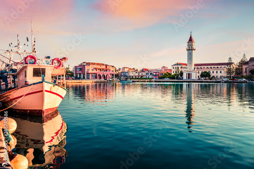 Romantic spring sunset in Zakynthos city. Dramatic evening view of the town hall and Saint Dionysios Church, Ionian Sea, Zakynthos island, Greece, Europe. Traveling concept background.