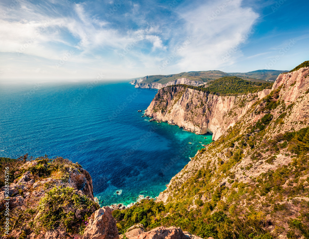 Aerial spring view of high cliffs on the Ionian Sea. Sunny morning seascape of Zakynthos (Zante) island, Greece, Europe. Beauty of nature concept background.