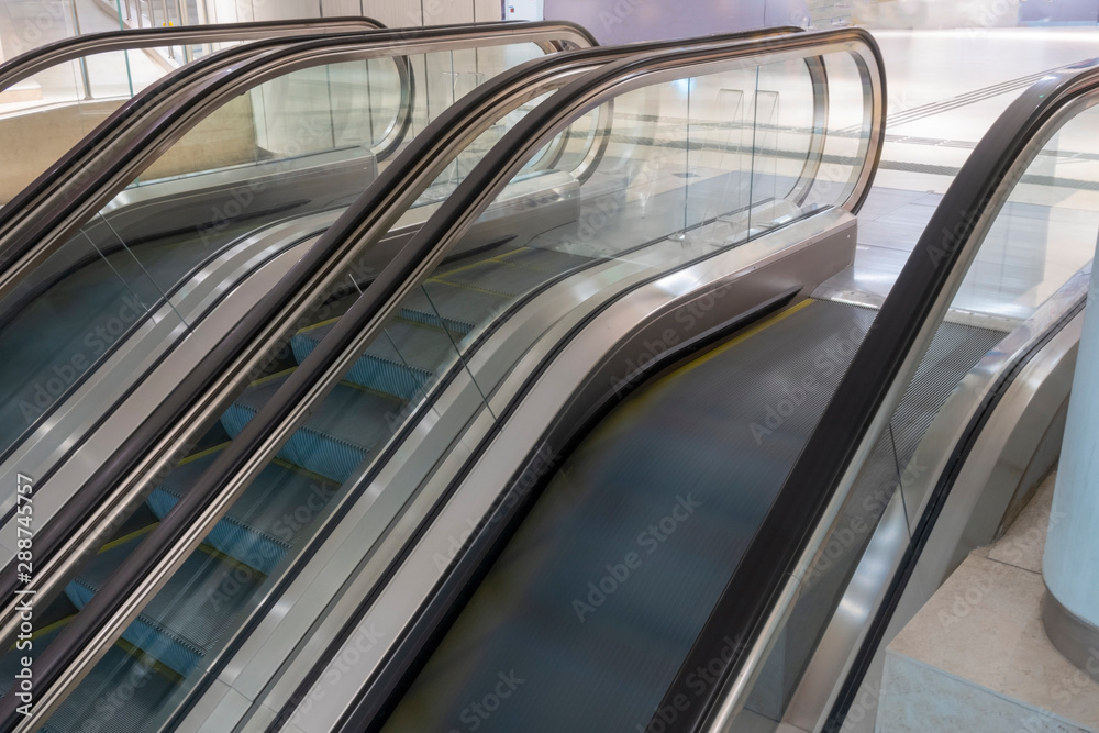 3 escalators. Middle one is out of operation. No people. 3 escalators. Middle one is out of operation. No people.