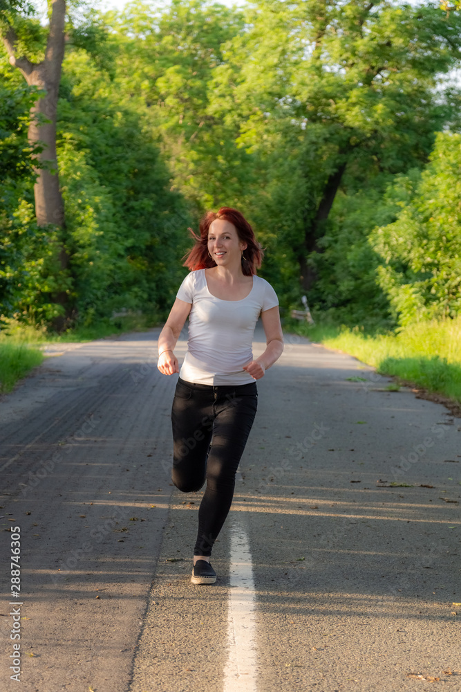 woman with white shirt runs on a street