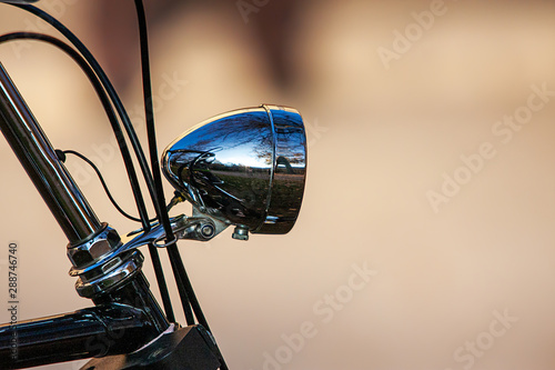 Bicycle lamp on old, well-kept bicycle photo