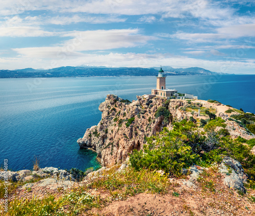 Fototapeta Naklejka Na Ścianę i Meble -  Bright sunny view of Melagavi lighthouse in the Corinth Gulf. Picturesque spring seascape in the Greece, Europe. Beauty of nature concept background. Artistic style post processed photo.
