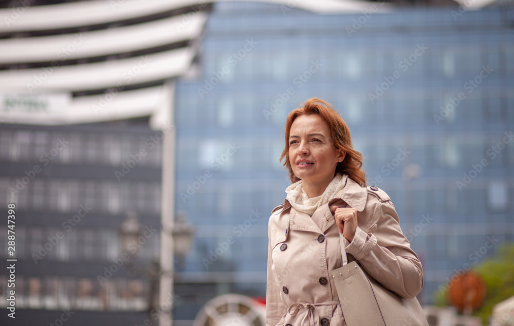 One mature woman, portrait in a urban city.One mature woman, portrait in a urban city. One mature woman, portrait in a urban city.One mature woman, portrait in a urban city.