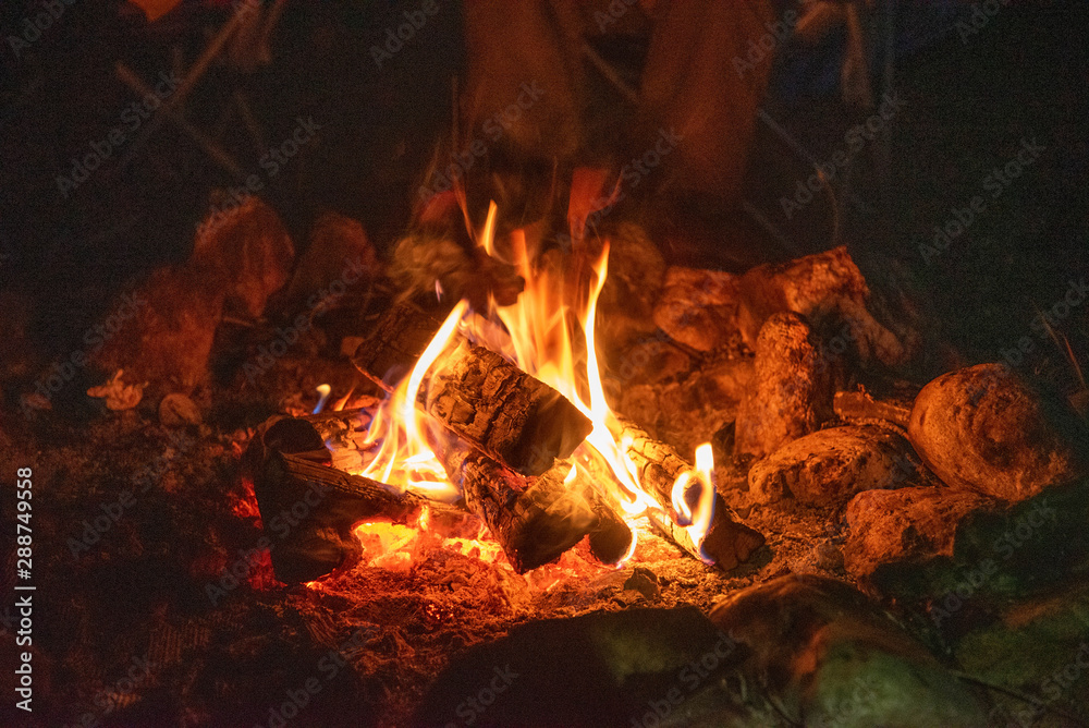 Sitting by the campfire at night. Sitting by the campfire at night.