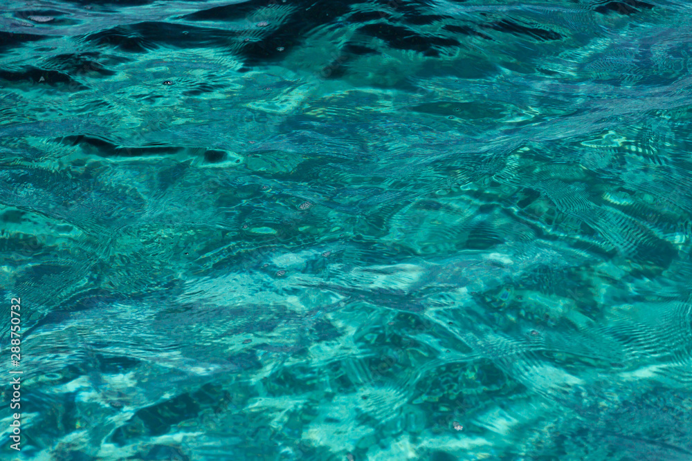 Clear turquoise sea water on sardinian seashore Clear turquoise sea water on sardinian seashore
