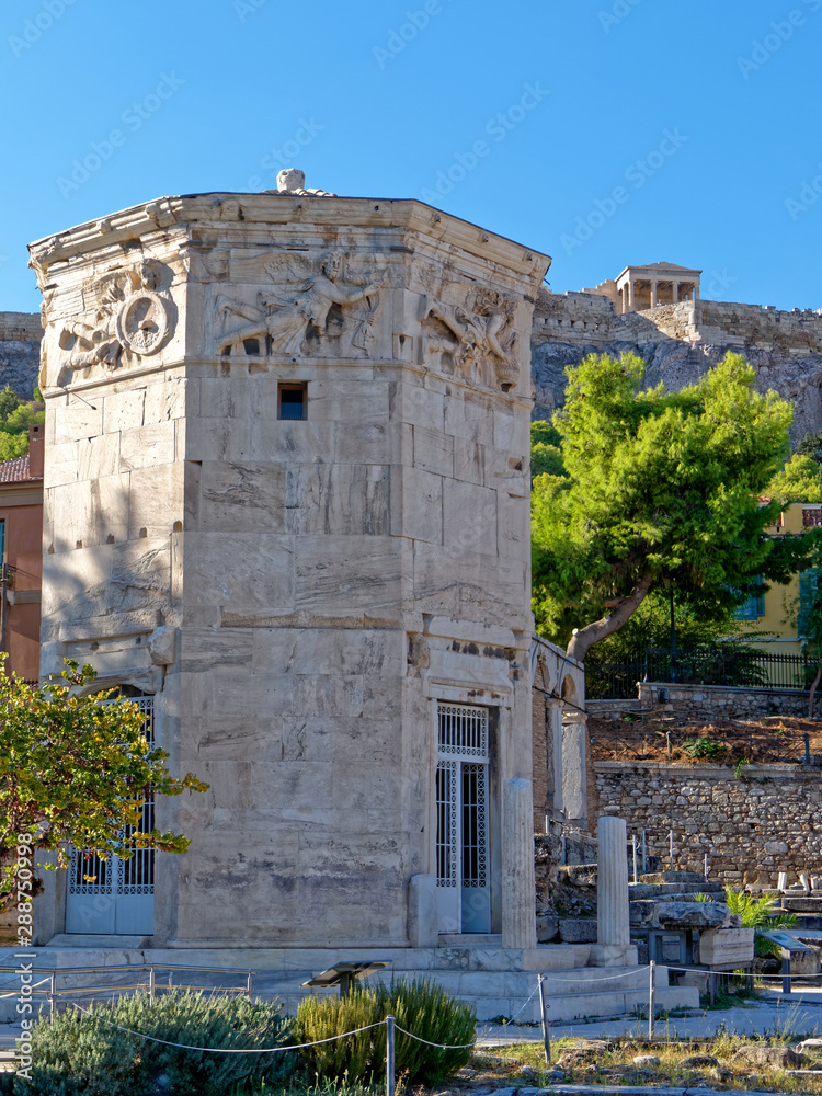 Acropolis hill over the winds tower in the Roman forum, Athens Greece