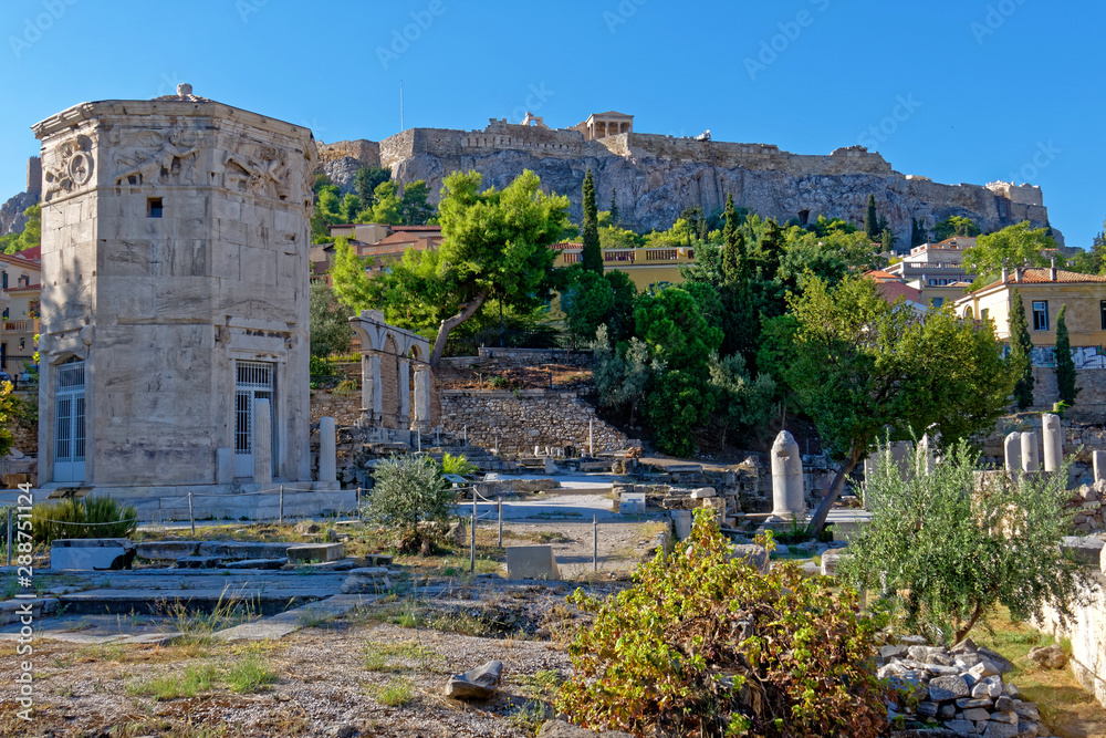 Acropolis hill over the winds tower in the Roman forum, Athens Greece
