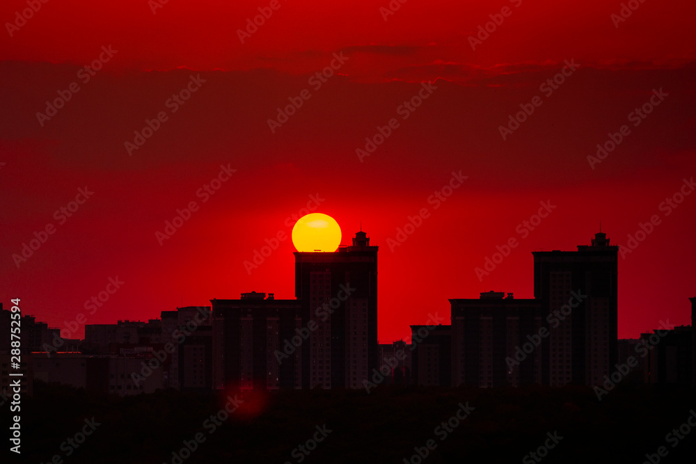 Sunset over high modern urban buildings in Voronezh