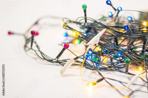 wires rewound with electrical tape on a Christmas garland. independent repair of electrical appliances and a fire in the new year