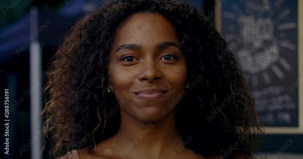 Portrait of an attractive African American black female posing in the street. 4K UHD Portrait of an attractive African American black female posing in the street. 4K UHD