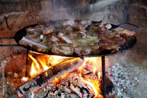 frying meat and bacon on traditional way