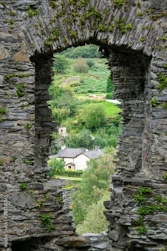 Fototapeta Naklejka Na Ścianę i Meble -  Stone Window in an Abandoned Castle Ruins 