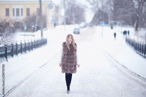 walk in a winter park christmas girl / beautiful model posing in the winter season walk city park © kichigin19