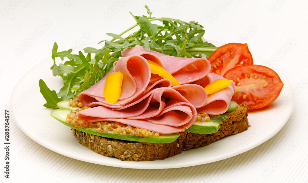 Mango and Ham open Sandwich with  tomato and rocket