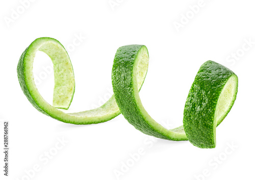 Peel of lime isolated on a white background. Lime peel in spiral form.