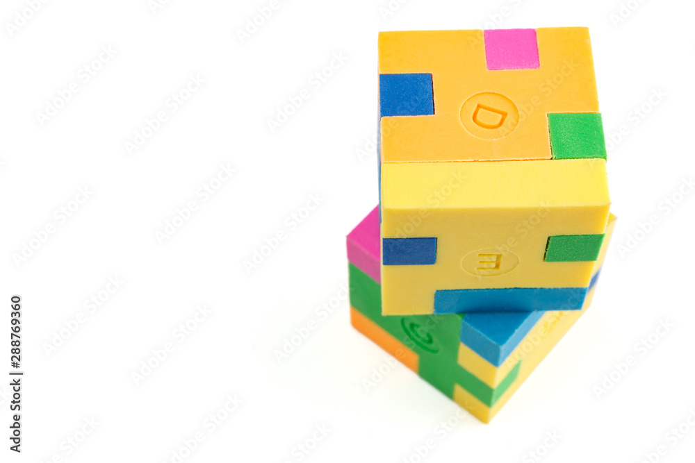 Two cube puzzle of multi-colored rubber shapes. Concept of decision making process, creative, logical thinking. Logical tasks. Two cube puzzle of multi-colored rubber shapes. Concept of decision making process, creative, logical thinking. Logical tasks.