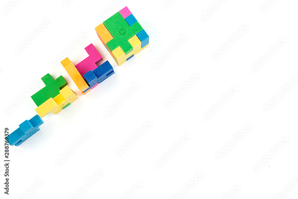 Cube puzzle of multi-colored rubber shapes. Concept of decision making process, creative, logical thinking. Logical tasks. Cube puzzle of multi-colored rubber shapes. Concept of decision making process, creative, logical thinking. Logical tasks.