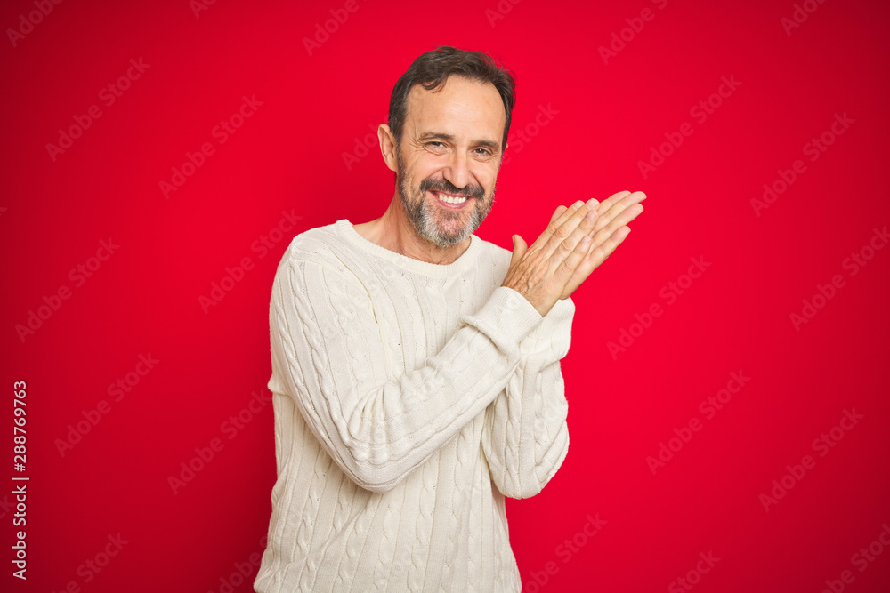 Handsome middle age senior man with grey hair over isolated red background clapping and applauding happy and joyful, smiling proud hands together Handsome middle age senior man with grey hair over isolated red background clapping and applauding happy and joyful, smiling proud hands together