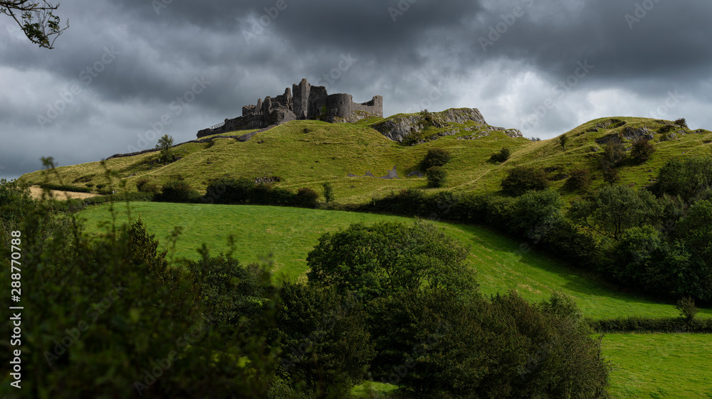 Carreg Cennen castle sits high on a hill near the River Cennen, in the village of Trap, four miles south of Llandeilo in Carmarthenshire, south Wales