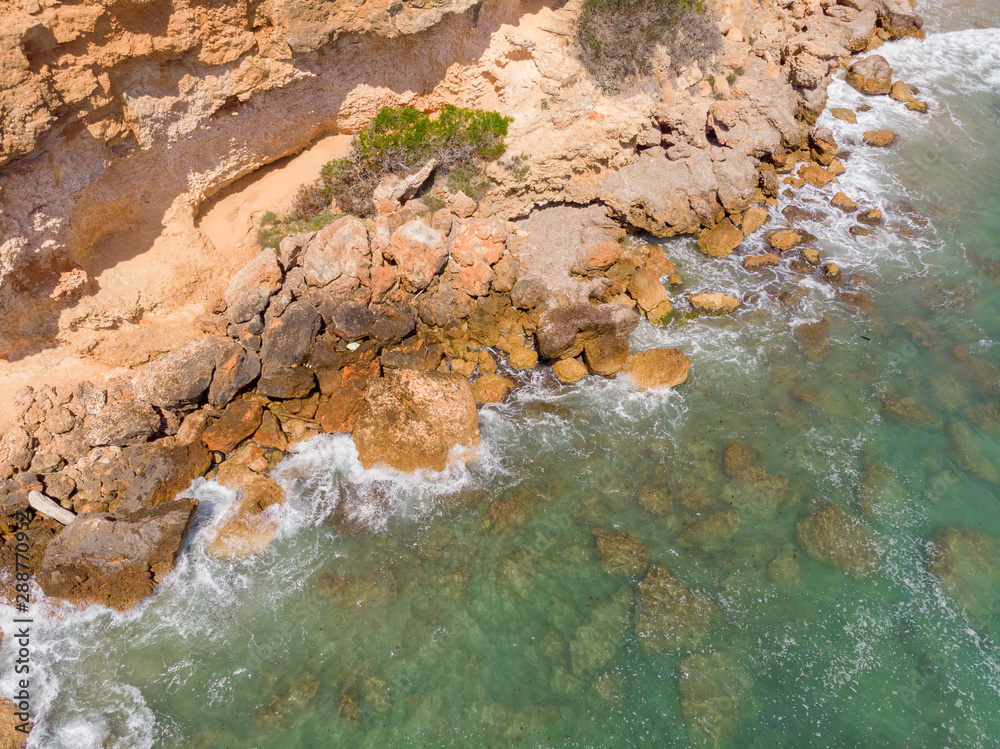 The top view of cliff in Costa Dourada, Catalonia, Spain. Drone aerial photo