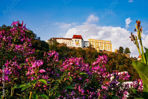 Fortress in Passau with flowers in foreground, Germany