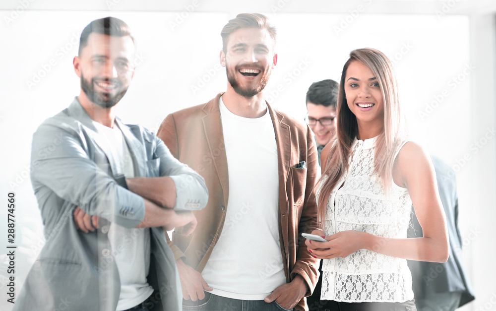 Obraz premium three young employees of the company standing in the office