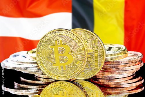 Concept for investors in cryptocurrency and Blockchain technology in the Belgium and Austria. Bitcoins on the background of the flag Belgium and Austria.