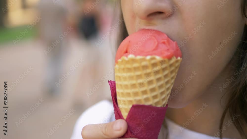 teen girl eating ice cream outdoors. The concept of childhood, lifestyle, food, summer. teen girl eating ice cream outdoors. The concept of childhood, lifestyle, food, summer.