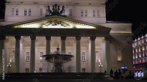 Beautiful vintage facade of the Bolshoi Theater, Moscow. The building was built in 1776. Night time, view of the main entrance, which is decorated with stucco molding and stunning statues. Ultra HD