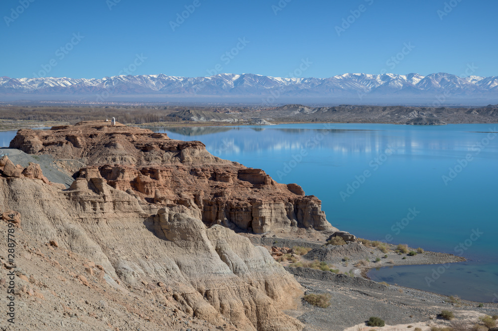 Dry desert badlands at the Lago Cuesta del Viento reservoir in San Juan, Argentina