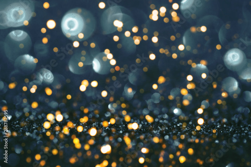 Blue and gold festive background with sparkles in the bokeh. The concept of the celebration  the day of St. Valentine  New Year  birthdays  ceremonies  events  etc.