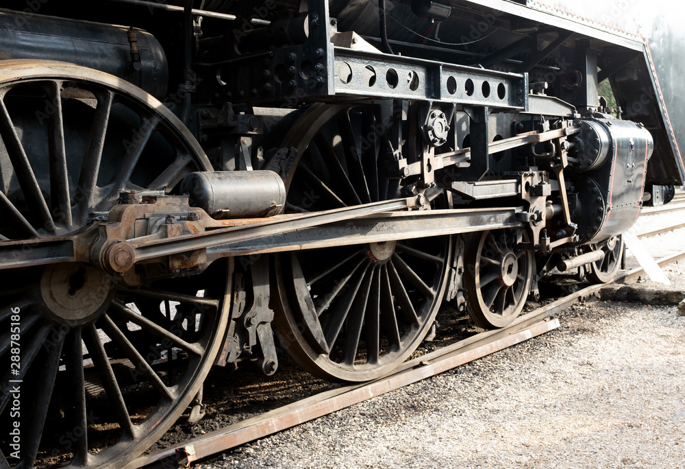 Old steam engine detail with wheels Old steam engine detail with wheels