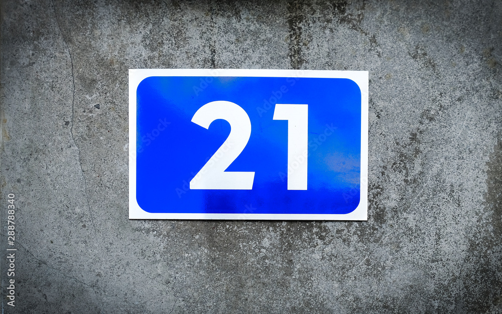 21, number twenty-one, blue number plate on graded gray background. 21, number twenty-one, blue number plate on graded gray background.