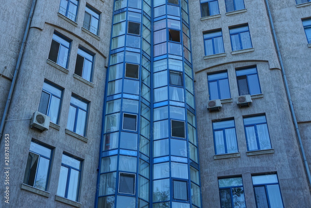 texture of blue windows and balconies on the wall 