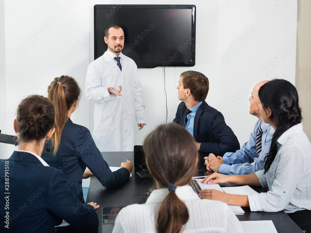 Fototapeta premium Scientist presenting report during working meeting