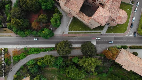 Aerial road from vignola to savignano with cars driving and Castle of Vignola Rocca September 2019 Modena Emilia Romagna 4K photo