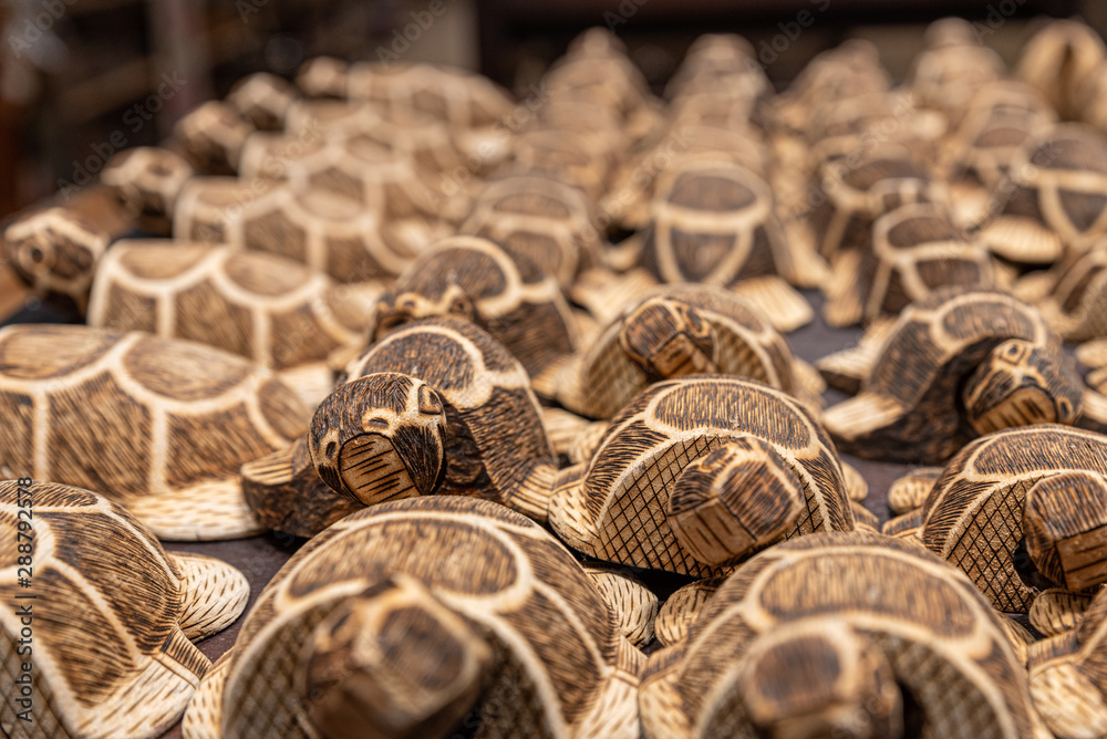 balinese wooden turtle statues on a shelf balinese wooden turtle statues on a shelf