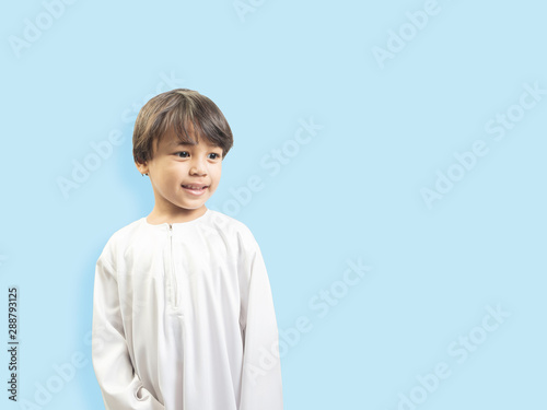 Muslim boy in a dress , isolate background