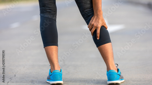 Sports Asian woman feeling pain sore leg