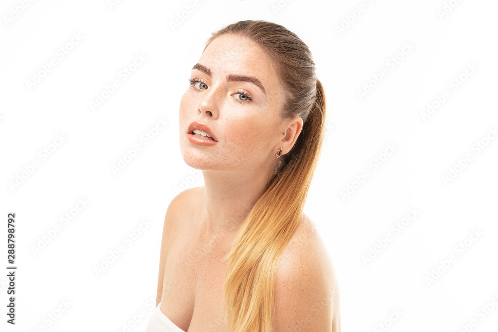 Clean face of young woman with freckles. Clean face of young woman with freckles.