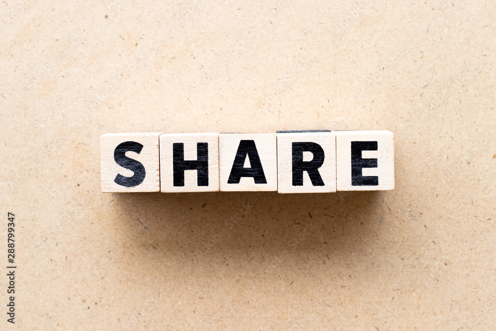 Fototapeta premium Letter block in word share on wood background