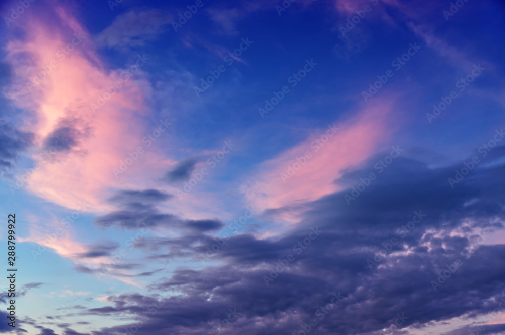 Dramatic sunset and sunrise sky with beautiful pink, yellow and blue clouds