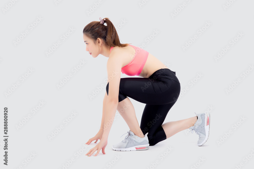 Fototapeta premium beautiful young asian woman slim start running isolated on white background, asia girl is confident workout cardio with run for strong, female ready to exercise, activity for health concept.